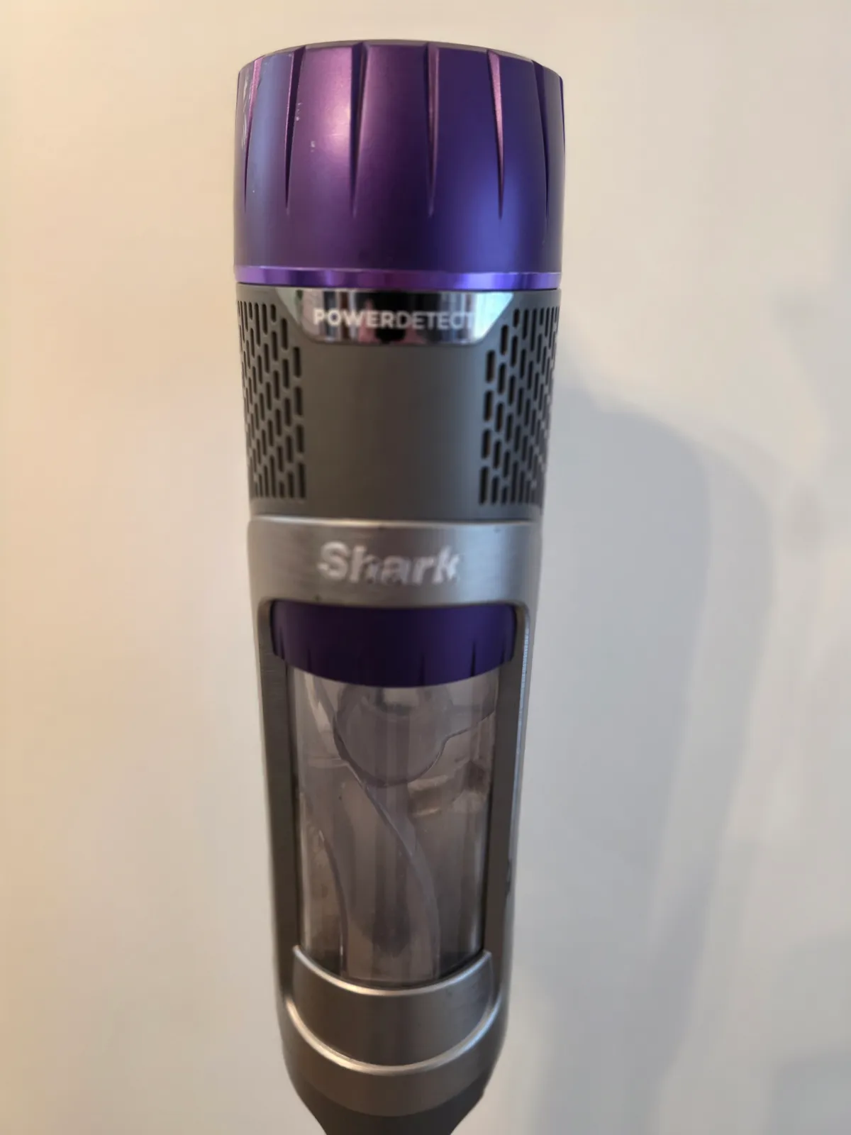Close-up of the Shark PowerDetect motor body and clear dust cup